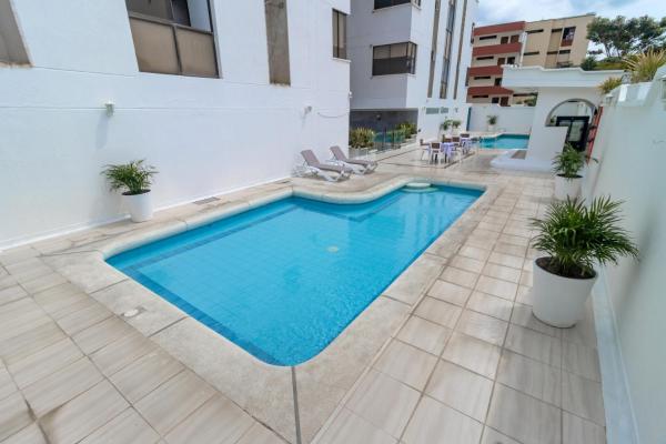 Отель Axis Inn by GEH Suites