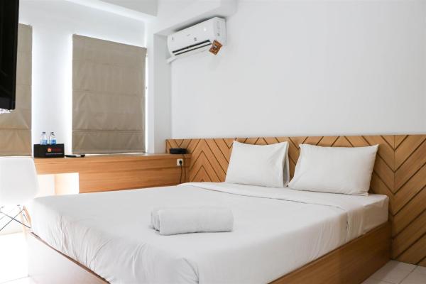 Minimalist and Cozy 1BR Patraland Urbano Apartment By Travelio
