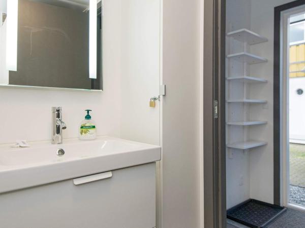 6 person holiday home on a holiday park in Ebeltoft