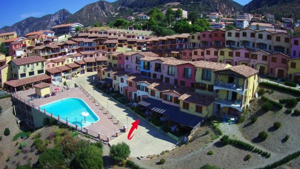 Villetta bordo piscina vista mare Wi-Fi Gratis, Забронировать Дом для отпуска Небида Сардиния