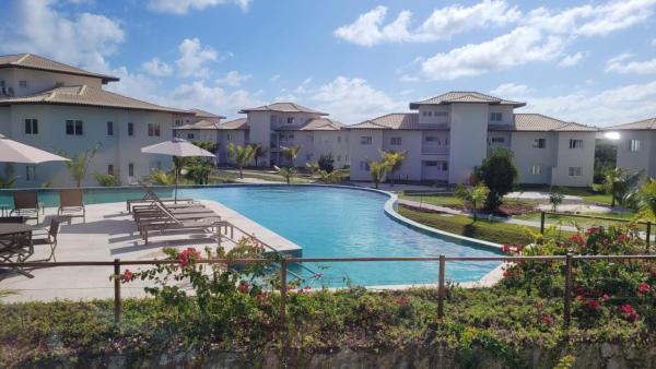 Apartamento no Village dos Ipês em Praia do Forte, Забронировать  Прайя-ду-Форте 