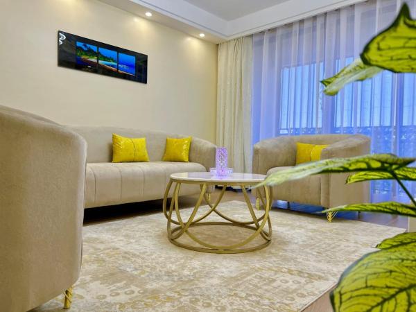 elegant viewpoint apartment with heated swimming pool fully equipped gym private parking space children playing ground and a relaxing rooftop with amazing city views, Забронировать Апартаменты/квартира Найроби Руанда, рядом с Nairobi Arboretum