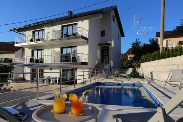 Helvetia Apartments, Забронировать Апартаменты/квартира Отели Яйце с бассейном, Бассейн