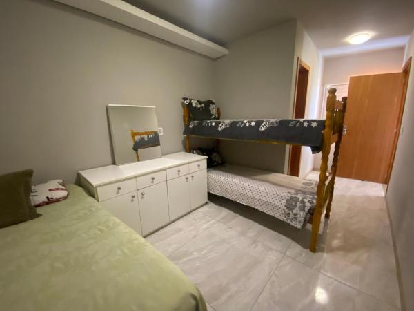 Suíte por do sol 1 privada casa compartilhada, Забронировать  Шангри-ла Риу-Гранди-ду-Сул
