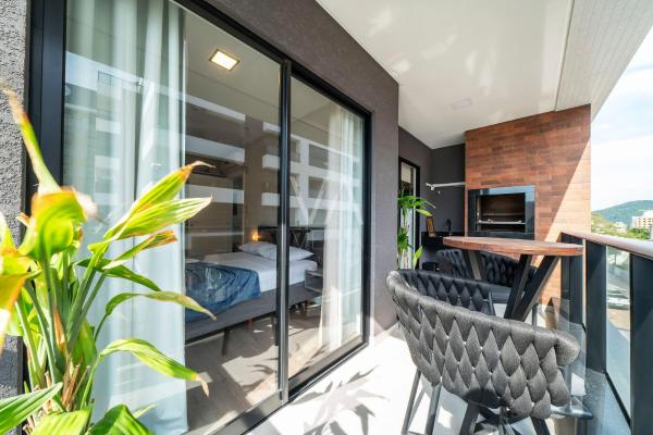 203- Apart com vista mar e piscina, Забронировать  Отели Санта-Катариной с парковкой, Парковка