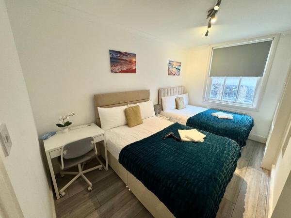 Cosy Private Bedrooms in Kings Cross, Забронировать  Лондон Большой Лондон, рядом с Колонна Нельсона