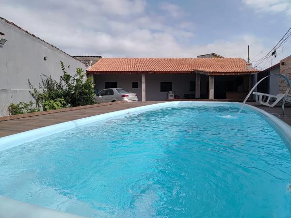 CASA NA PRAIA ITANHAEM para 10 pessoas com total conforto, Забронировать  Отели Сан-Паулу с парковкой, Парковка