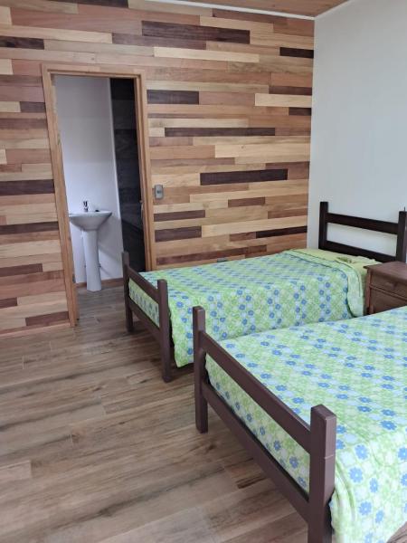 Piezas estilo departamento en casa Pucón, Забронировать  Отели в центре Пукон, в центре