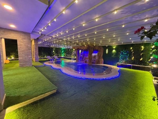 7 BR Smart House with Heated Pool, Waterfall, Garden, Забронировать  Каир Аль Каира