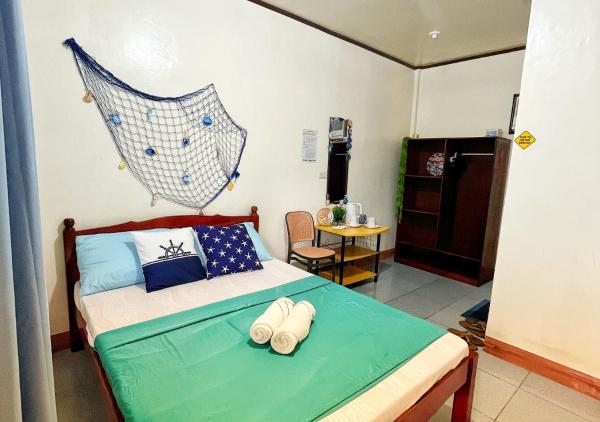 Comfortable Studio Near the Beach and Town Center with Free Parking by Bantayan Paw and Palm Stays, Забронировать  Paso de la Patria Висайские острова