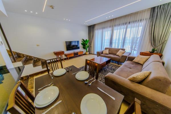 Porto New Cairo - Nyoum compound Modern 2-Bedroom, Prime Location, Забронировать  Каир Аль Каира