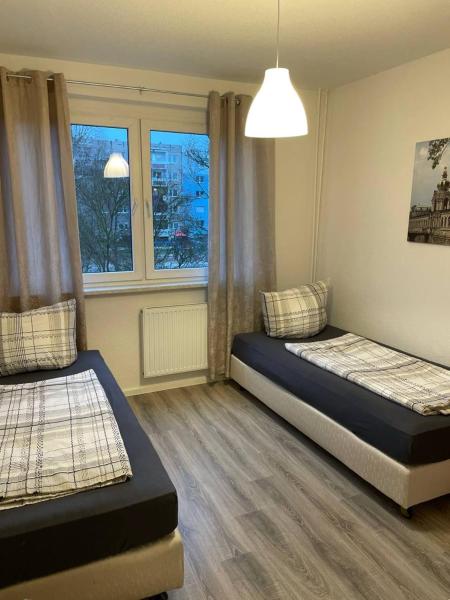 Zweibettzimmer für Monteure in Dessau 3-Zimmer-Wohnung mit Gemeinschaftsküche und -Bad, Забронировать  Мильдензее Саксония-Ангальт