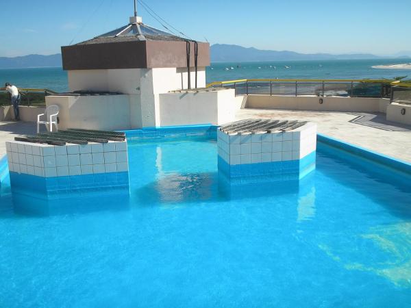 Apartamento vista mar, Ponta das Canas com duas piscinas, Забронировать  Отели Флорианополиса с парковкой, Парковка