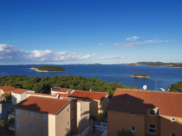 Apartments Prgin Križan, Забронировать Апартаменты/квартира Примоштен 