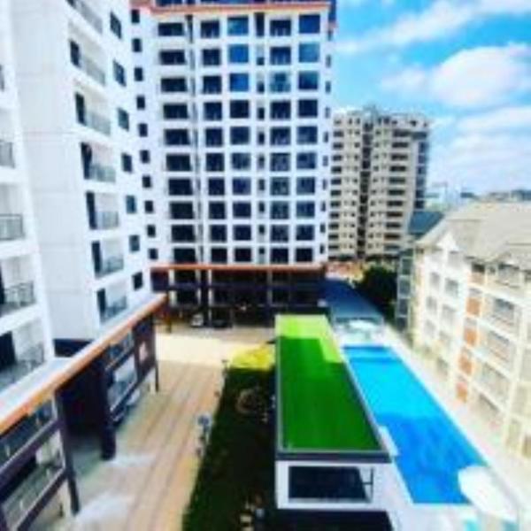 stunning two bedroom apartment with heated swimming pool fully equipped gym ample parking space and a relaxing rooftop with breathtaking views, Забронировать Апартаменты/квартира Найроби Найроби Каунти