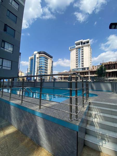 supreme newly furnished apartment with ample parking space, swimming pool ,fully equipped gym child play area and unbeatable city views, Забронировать Апартаменты/квартира Найроби Найроби Каунти