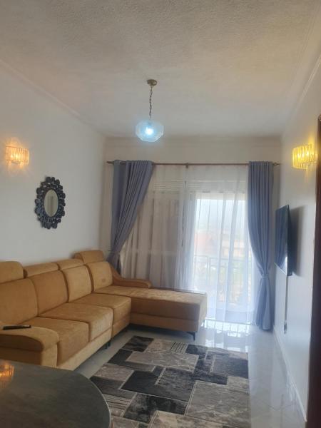 Two Bedrooms Apartment, located between kajjansi and kitende, with one bathroom, a living room, fully furnished kitchen, patio, free wifi, free parking space, Забронировать Апартаменты/квартира Отели Kajansi с парковкой, Парковка