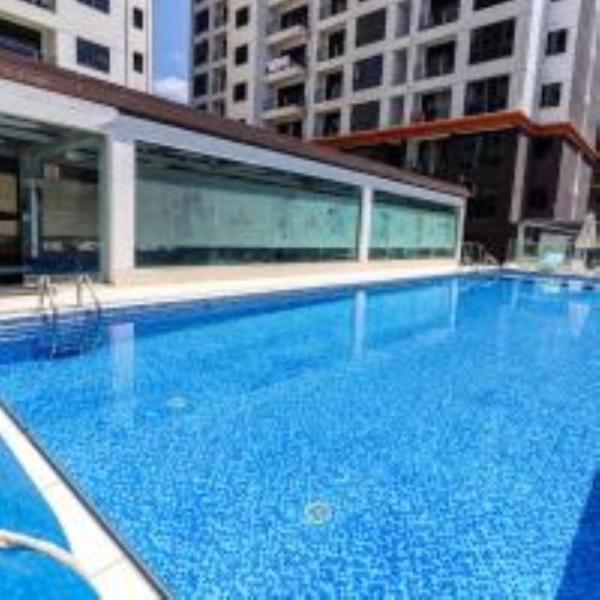 celestial suites apartment with heated swimming pool well equipped gym ample parking space children playing ground and relaxing rooftop with amazing scenic views, Забронировать Апартаменты/квартира Найроби Найроби Каунти